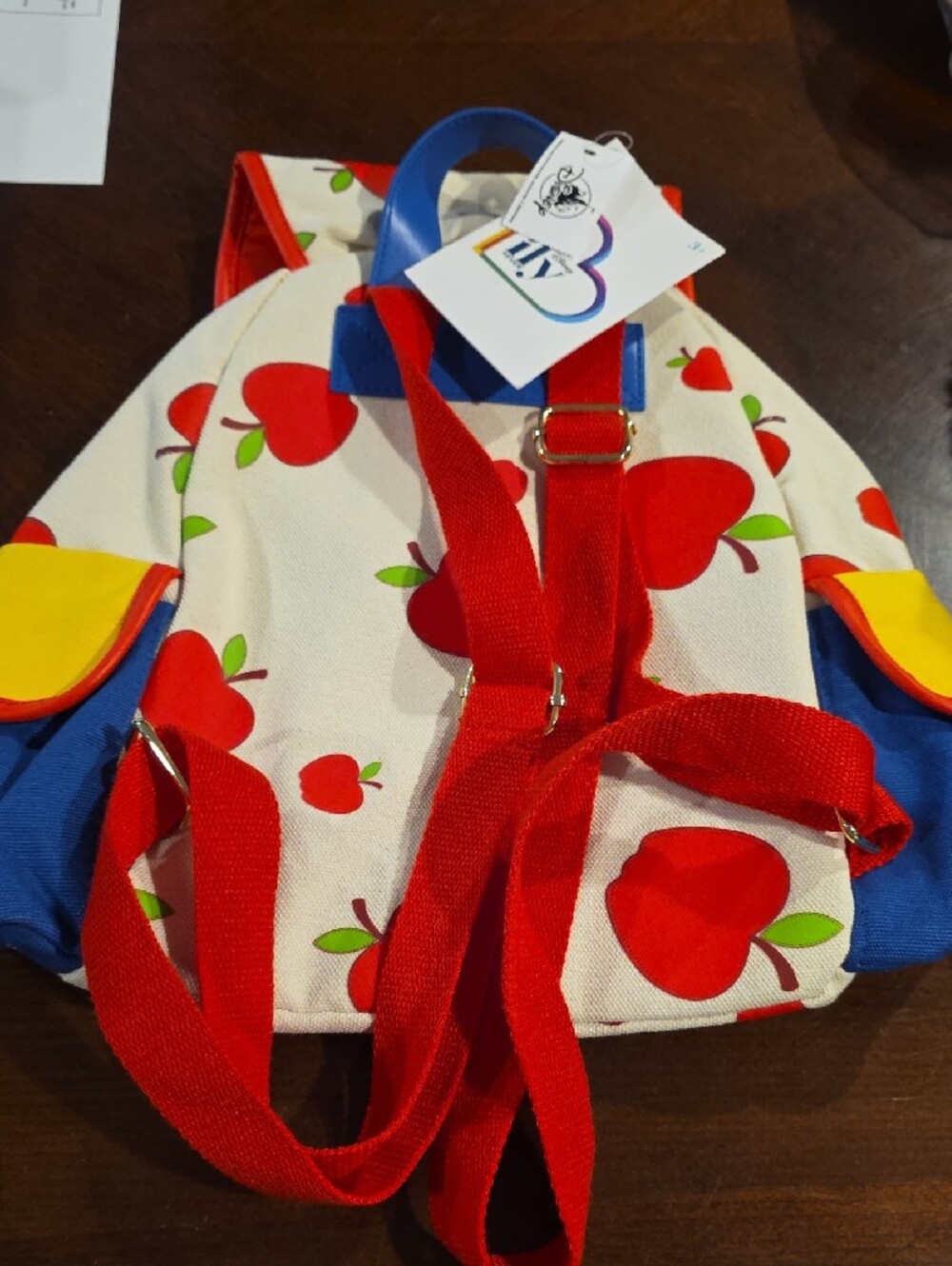(J51) Disney Cream Backpack with Red Apple Print and Blue Strap - Picture 5 of 6